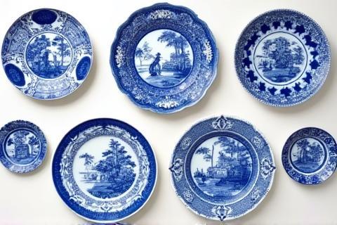 Set of decorative Delft Blue plates hanging on a wall with different intricate designs