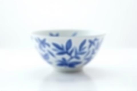 Modern styled Delft Blue bowl with abstract blue patterns on a minimalist background