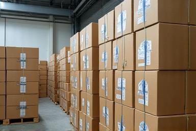 Stacks of carefully packaged boxes of Delft Blue porcelain ready for wholesale distribution